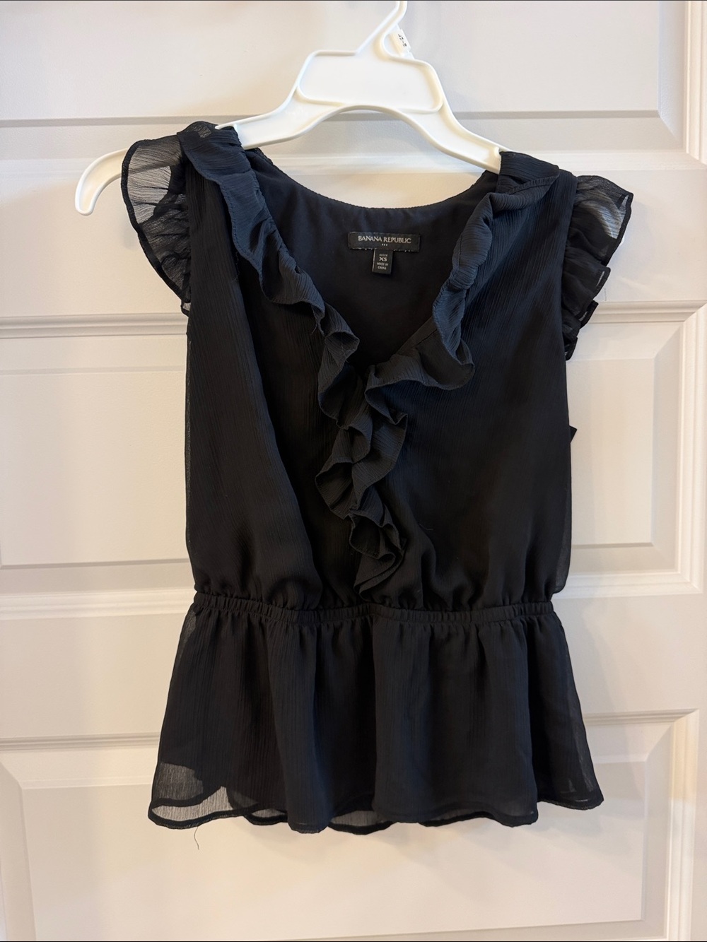 Banana Republic, extra small sleeveless blouse peplum style.